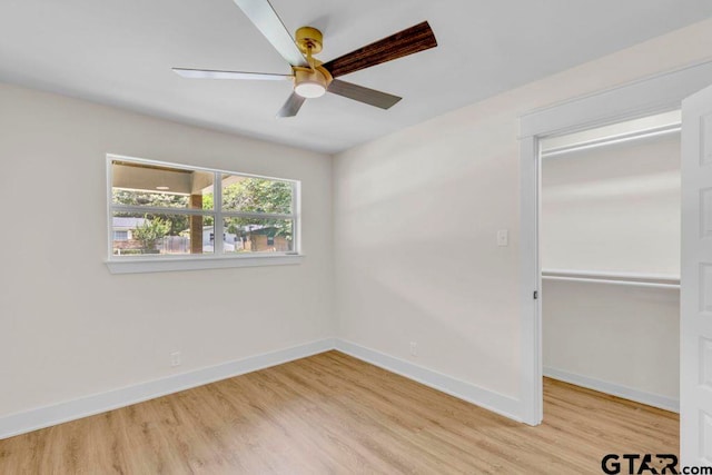 8100 Jewell Ln, Tyler, TX 75703 - unfurnished bedroom featuring wood finished floors, baseboards, a closet, and ceiling fan