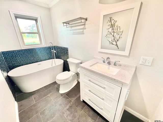 bathroom with a bath, vanity, toilet, and crown molding