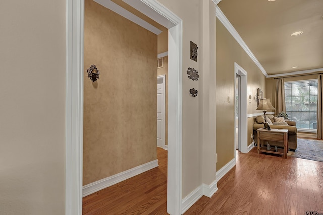 1014 Lovers Ln, Longview, TX 75604 - hallway with wood finished floors, crown molding, and baseboards