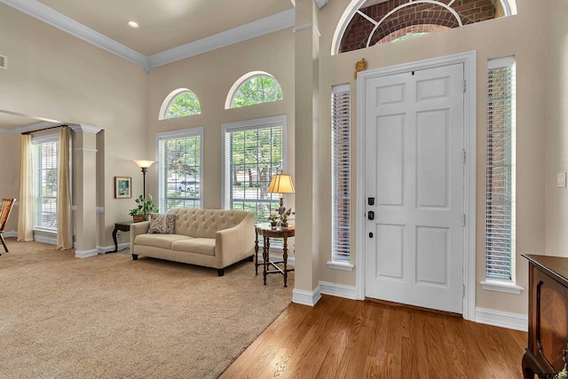 1014 Lovers Ln, Longview, TX 75604 - foyer featuring baseboards, ornamental molding, a high ceiling, wood finished floors, and recessed lighting