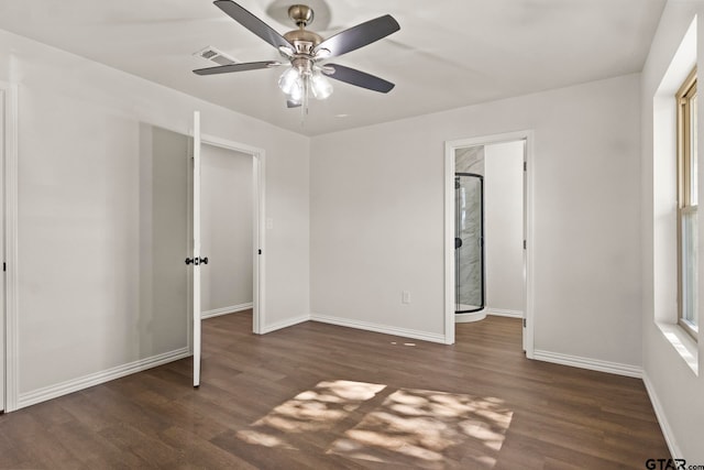 unfurnished bedroom with ceiling fan and dark hardwood / wood-style floors