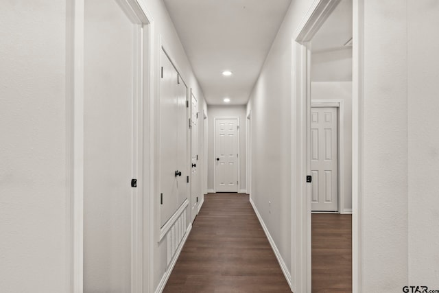 hallway featuring dark wood-type flooring