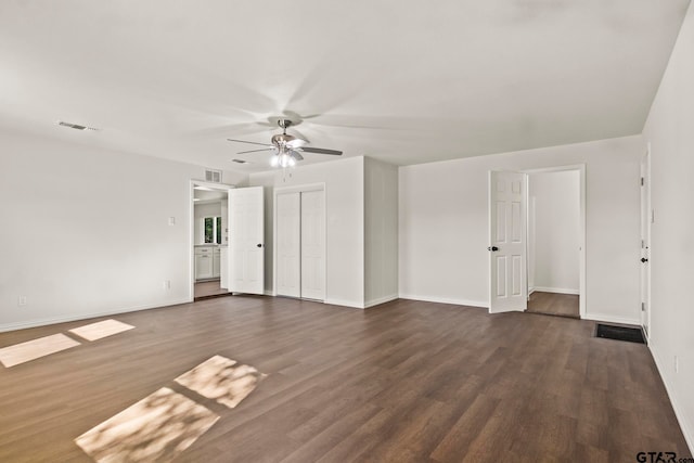 unfurnished room featuring dark hardwood / wood-style floors and ceiling fan