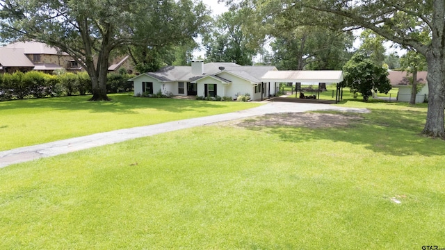 17893 Slack Rd, Whitehouse, TX 75791 - view of front facade with a carport, a chimney, and driveway