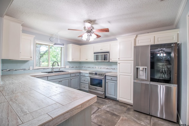 17893 Slack Rd, Whitehouse, TX 75791 - kitchen featuring appliances with stainless steel finishes, crown molding, backsplash, a textured ceiling, and white cabinets