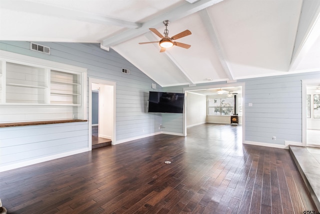 17893 Slack Rd, Whitehouse, TX 75791 - unfurnished living room featuring ceiling fan, wood walls, and dark wood-style flooring