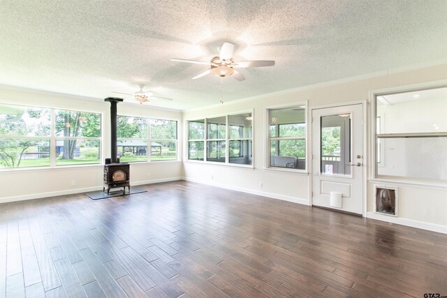 17893 Slack Rd, Whitehouse, TX 75791 - unfurnished sunroom featuring a wood stove