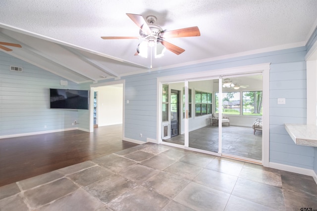 17893 Slack Rd, Whitehouse, TX 75791 - empty room with a ceiling fan, wooden walls, a textured ceiling, and vaulted ceiling