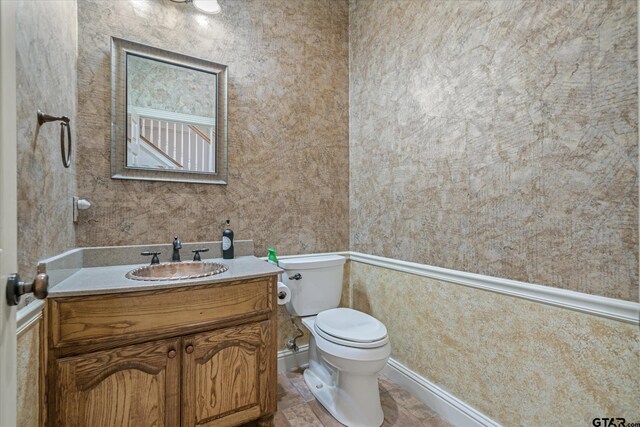 half bath with toilet and vanity