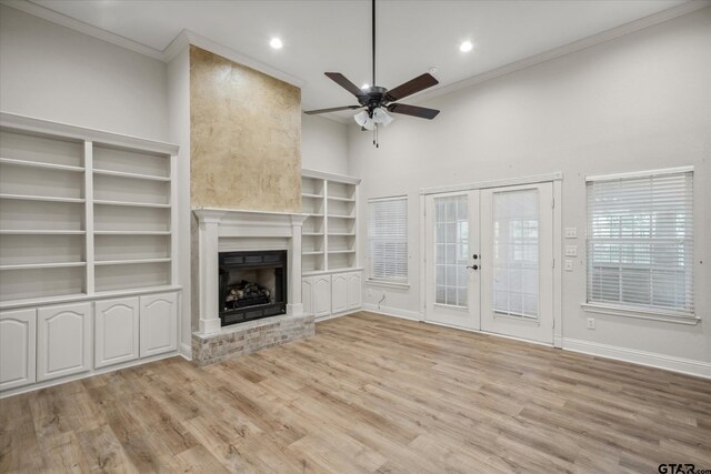 unfurnished living room featuring ceiling fan, ornamental molding, french doors, and light wood-style floors