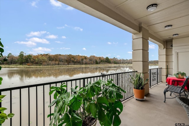 balcony featuring a water view