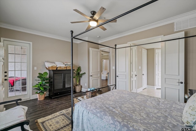 bedroom with hardwood / wood-style flooring, ceiling fan, and crown molding