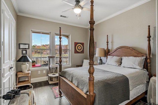 bedroom with ceiling fan, dark hardwood / wood-style flooring, and crown molding