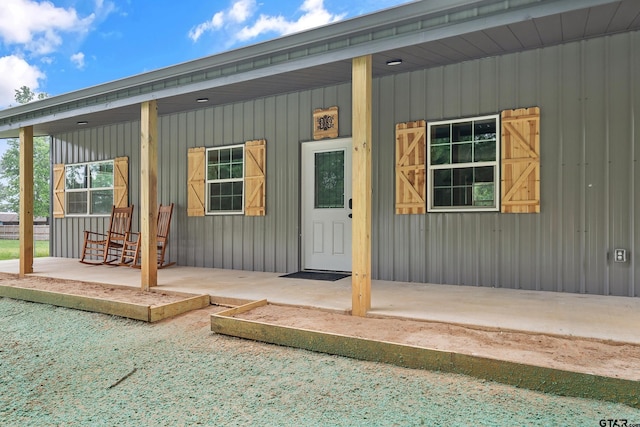 9089 Raspberry Ave, Frankston, TX 75763 - view of front facade with metal roof, a detached carport, covered porch, and fence