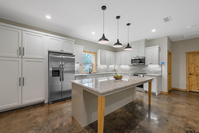 9089 Raspberry Ave, Frankston, TX 75763 - kitchen featuring a sink, concrete floors, decorative backsplash, stainless steel appliances, and white cabinets