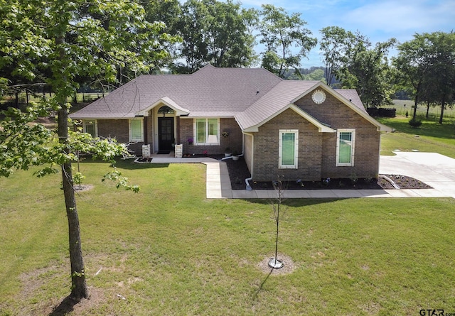 craftsman-style house featuring brick siding and a front lawn