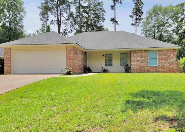 ranch-style home with a garage and a front lawn