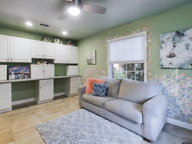 living room featuring ceiling fan