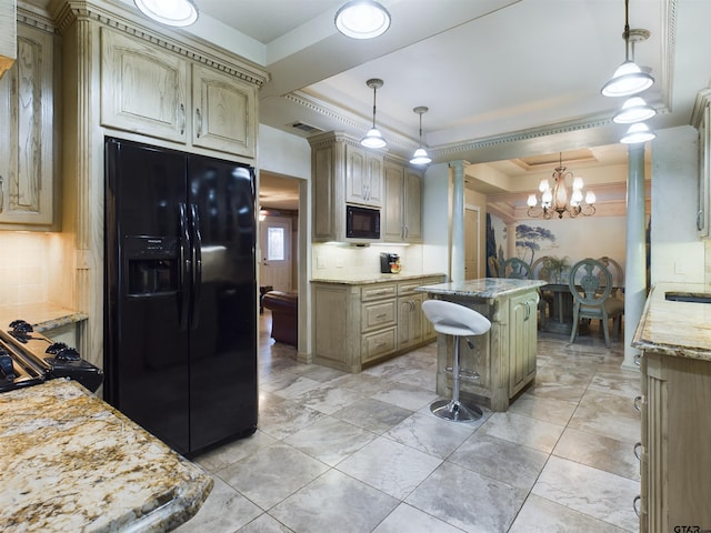 kitchen featuring black appliances, a kitchen island, a raised ceiling, and hanging light fixtures