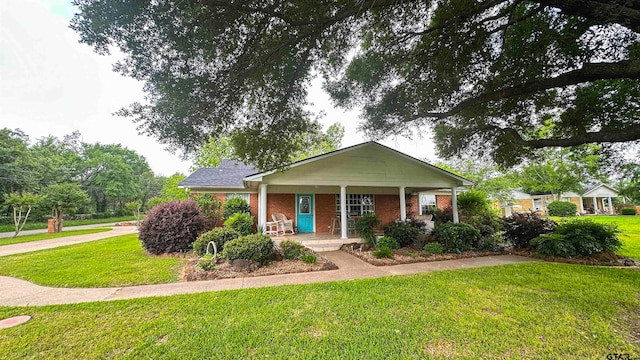 view of front of home with a front lawn and covered porch