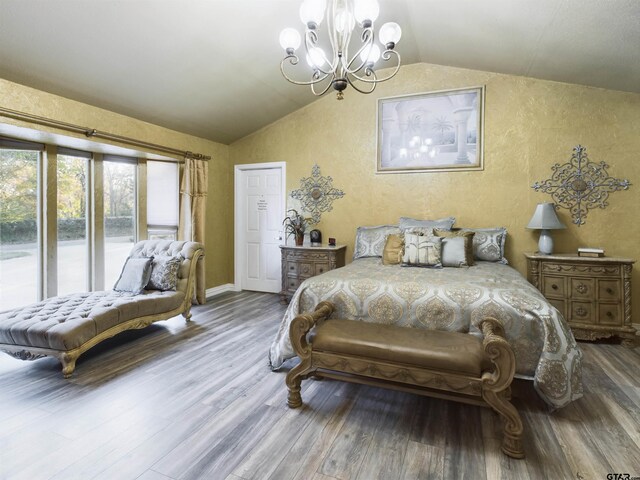 bedroom with hardwood / wood-style floors, lofted ceiling, access to outside, and an inviting chandelier