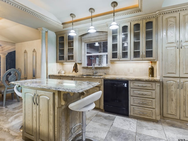 kitchen with black dishwasher, a tray ceiling, ornate columns, and sink