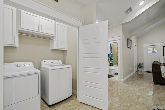 laundry area featuring cabinets and independent washer and dryer