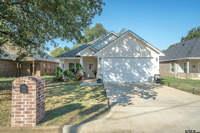 view of front of house featuring a garage and a front lawn