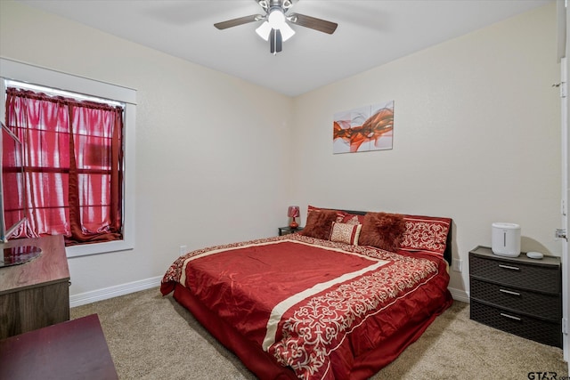 bedroom featuring light carpet and ceiling fan