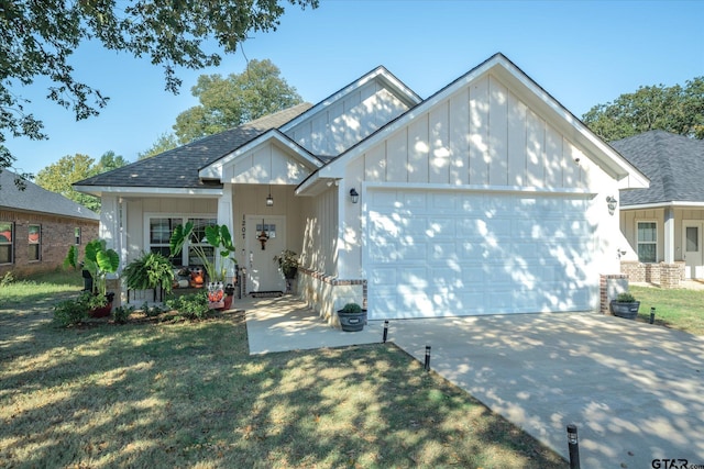 view of front of property featuring a garage and a front yard