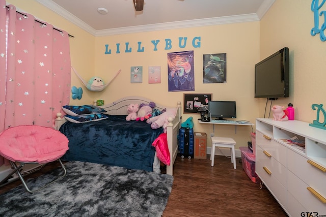 bedroom with ornamental molding and wood finished floors