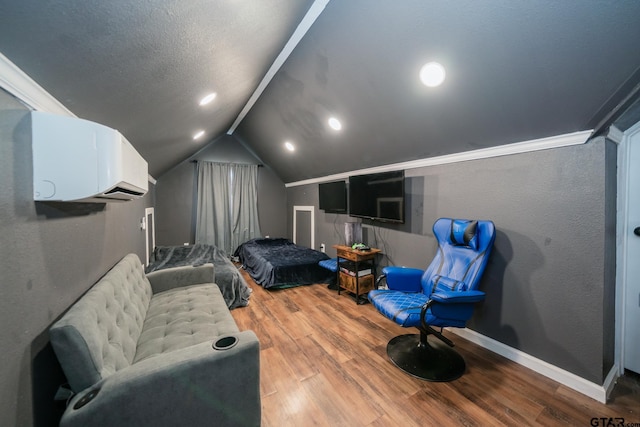 home theater room featuring baseboards, a textured wall, vaulted ceiling, a textured ceiling, and light wood-type flooring