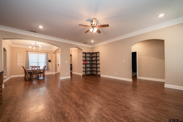 unfurnished living room featuring baseboards, visible vents, arched walkways, and dark wood finished floors