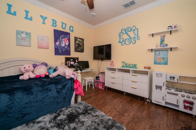 bedroom with ceiling fan, visible vents, crown molding, and wood finished floors