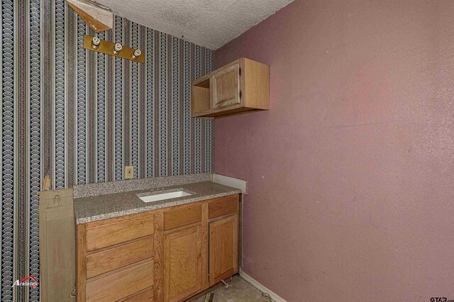 bathroom with a textured ceiling