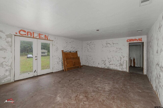 empty room featuring french doors