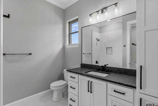 bathroom with a tile shower, tile patterned floors, toilet, vanity, and ornamental molding