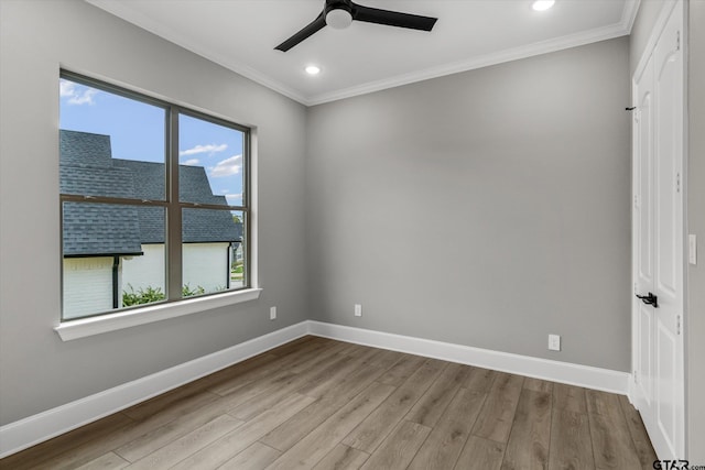 empty room with light hardwood / wood-style flooring, ceiling fan, and ornamental molding