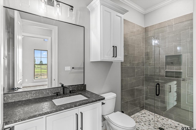 bathroom with toilet, an enclosed shower, crown molding, and vanity