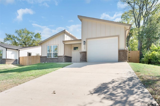 view of front of house with a garage and a front yard