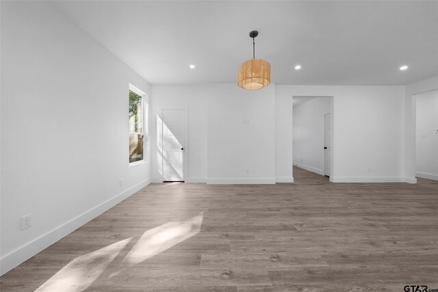 unfurnished living room with light hardwood / wood-style flooring