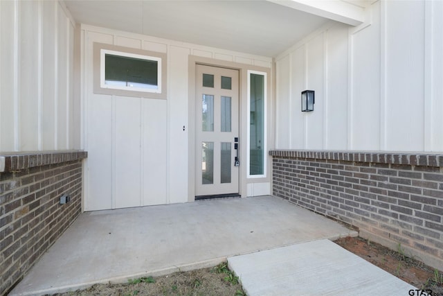 entrance to property with a patio area and french doors