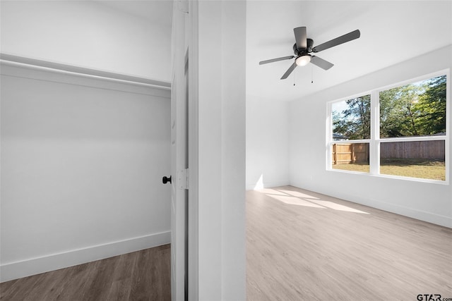 interior space with ceiling fan