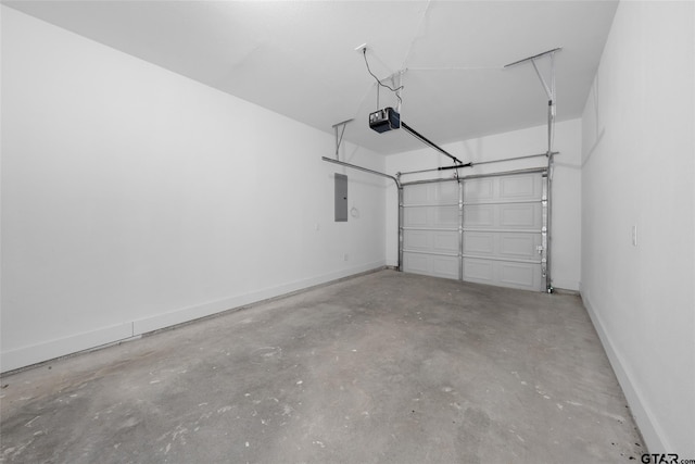 garage featuring electric panel and a garage door opener