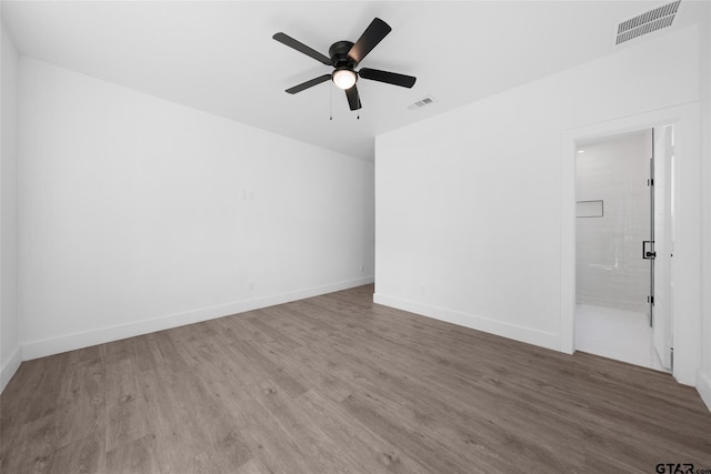 unfurnished room with hardwood / wood-style flooring and ceiling fan