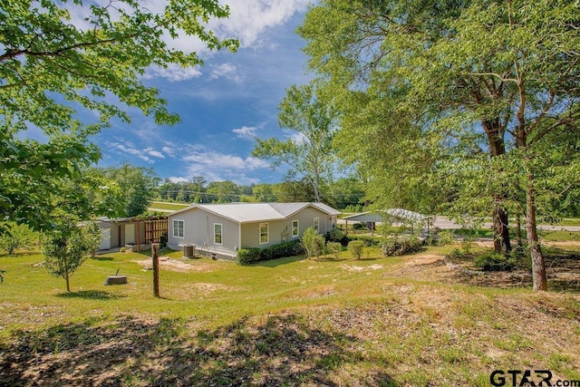 view of yard featuring central AC