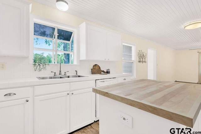 kitchen featuring white cabinets, a sink, a center island, wood ceiling, and tasteful backsplash