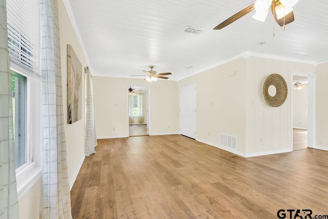 unfurnished living room with light wood finished floors, visible vents, and a ceiling fan