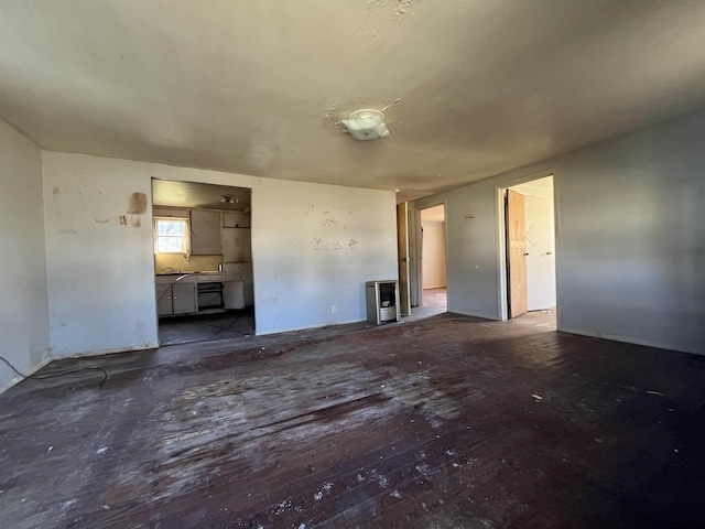 unfurnished living room featuring wood finished floors