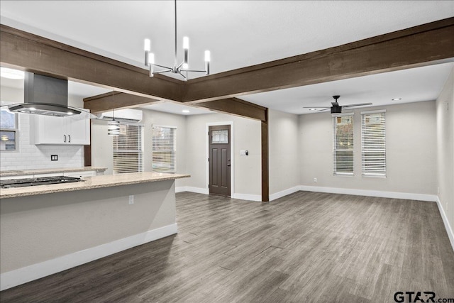 kitchen featuring pendant lighting, dark hardwood / wood-style floors, island range hood, and white cabinetry